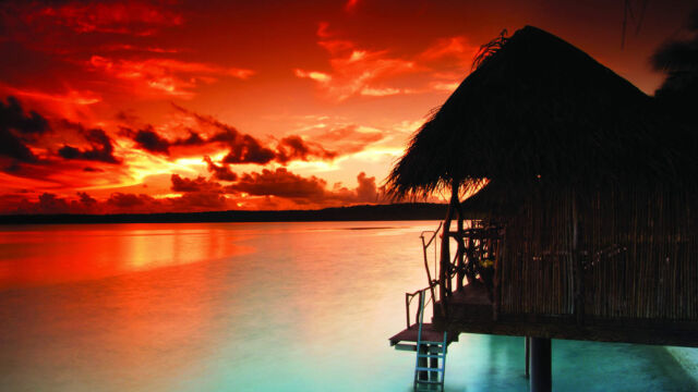 Over Water Bungalow at Sunset Aitutaki Over Water Bungalow at Sunset