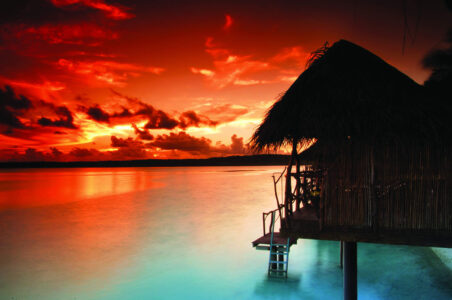 Over Water Bungalow at Sunset Aitutaki Over Water Bungalow at Sunset