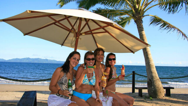 Enjoying drinks on the beach - Uprising Resort Enjoying drinks on the beach - Uprising Resort