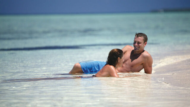Couple on Beach - Captain Cook Cruises Couple on Beach - Captain Cook Cruises
