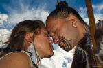 Maori man and woman doing hongi (traditional Maori greeting), Te Puia (New Zealand Maori Arts & Crafts Institute), Rotorua, New Zealand Maori man and woman doing hongi (traditional Maori greeting), Te Puia (New Zealand Maori Arts & Crafts Institute), Rotorua, New Zealand
